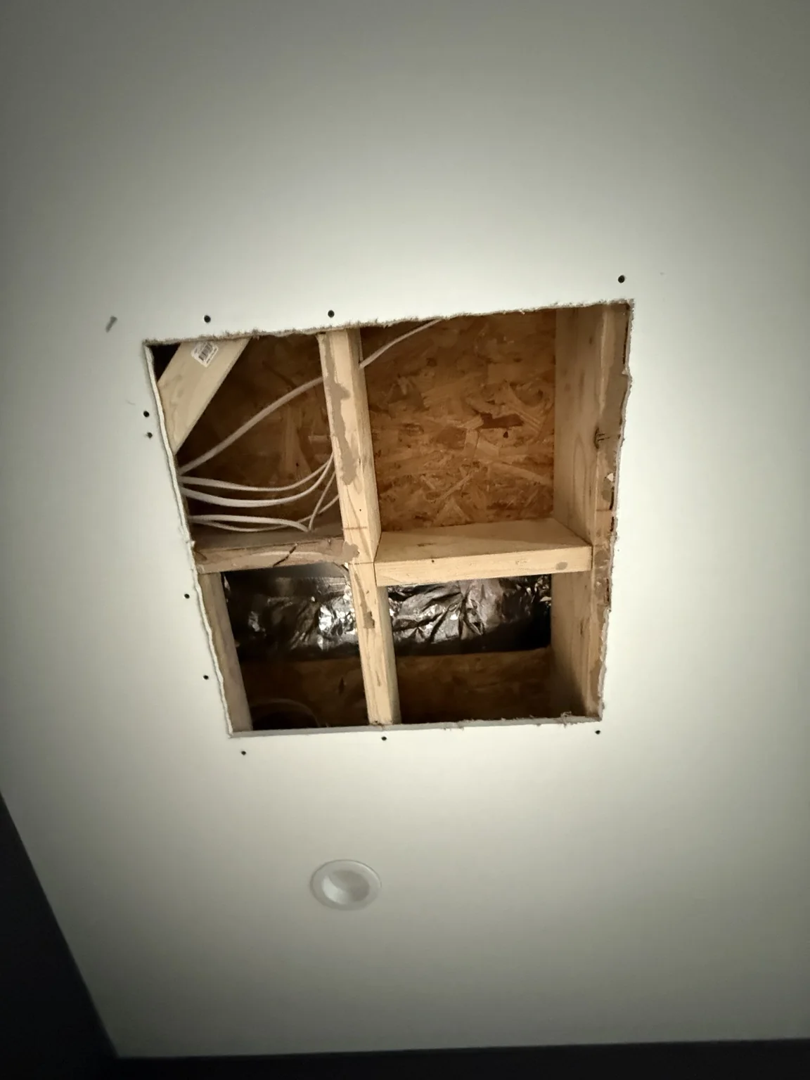 Rough ceiling service opening before custom access solution