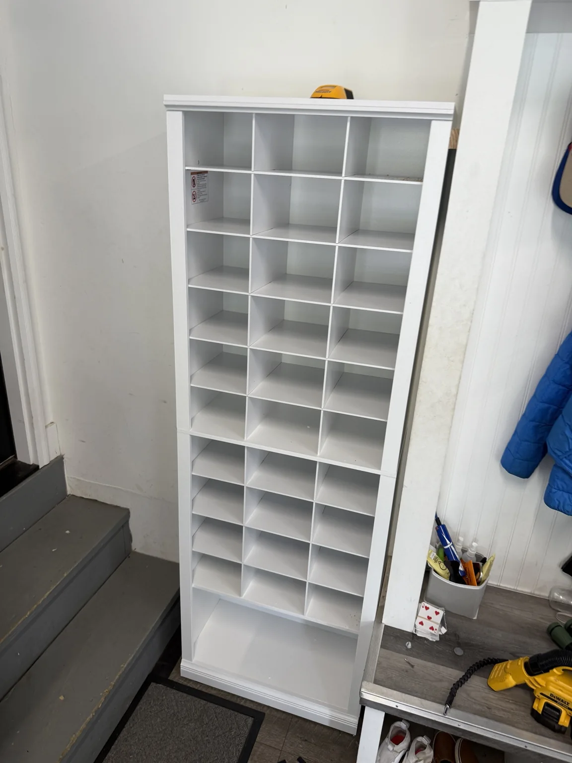 White custom cubby shoe storage after conversion