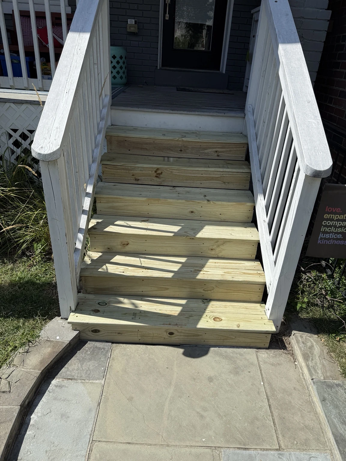 Finished exterior stairs rebuilt with new pressure-treated treads and risers